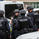 Police block access to a street near the scene of a shooting that left two dead in Halle, Germany
